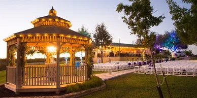 Lighted gazebo with chairs
